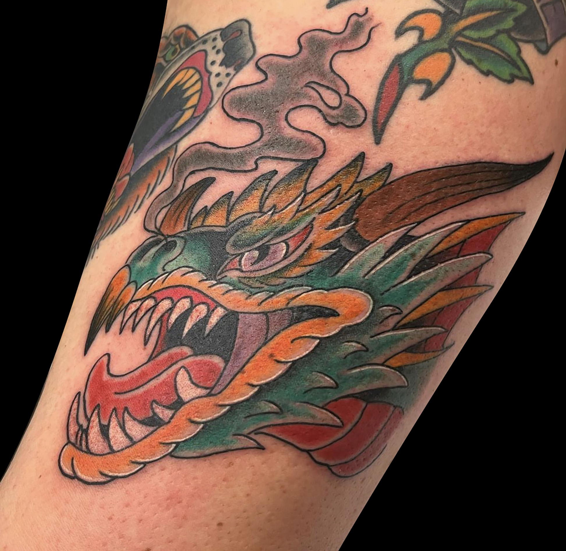 american traditional dragon head tattoo